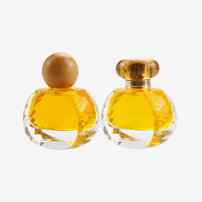 Transparent round glass perfume bottle