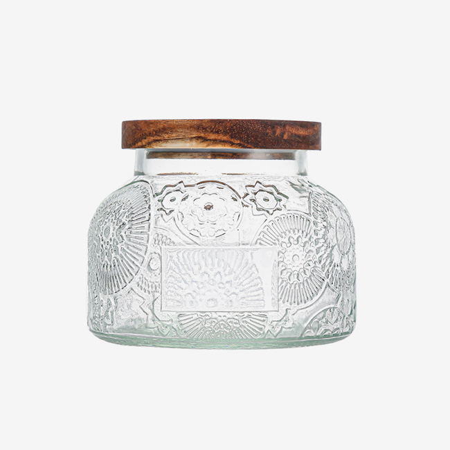 Embossed glass storage jar